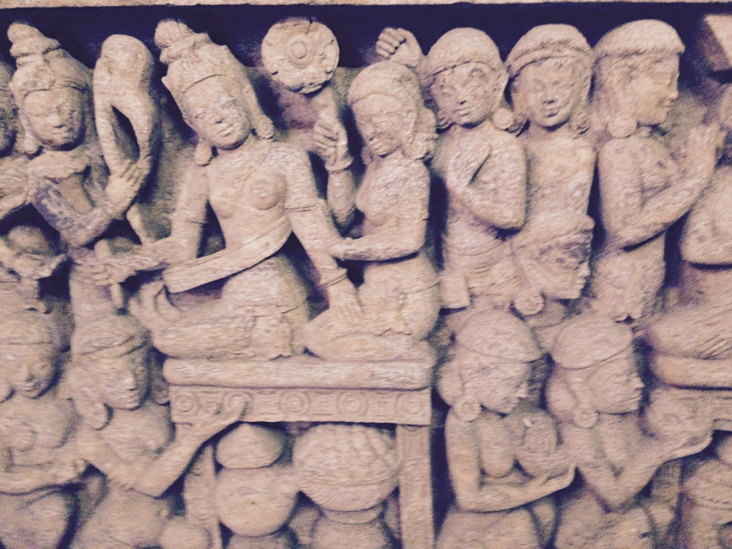 Hand-carved sandstone wall panel with intricate Buddhist prayer motifs and spiritual jali design