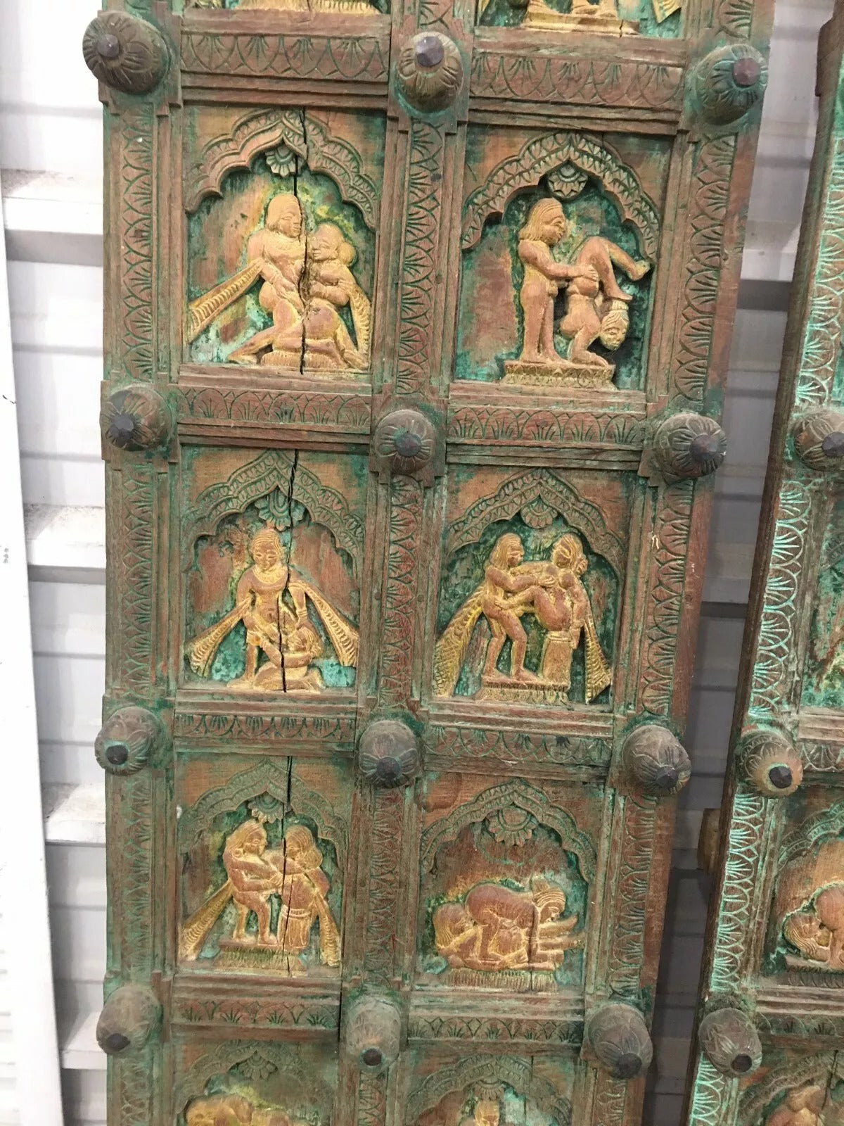 Side view of vintage wooden panel with romantic carvings