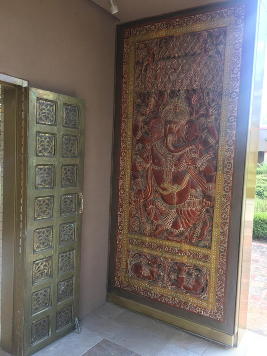 Traditional Indian Ganesha sculpture in solid wood with detailed motifs