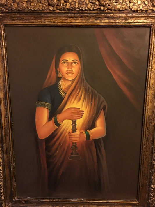 Antique framed painting of lady holding candle with light on her face