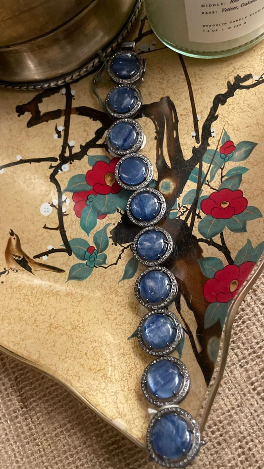 Exquisite Celestial Azure bracelet showcasing a 66-carat deep blue kyanite cabochon framed by a diamond halo, set in polished sterling silver on a neutral background