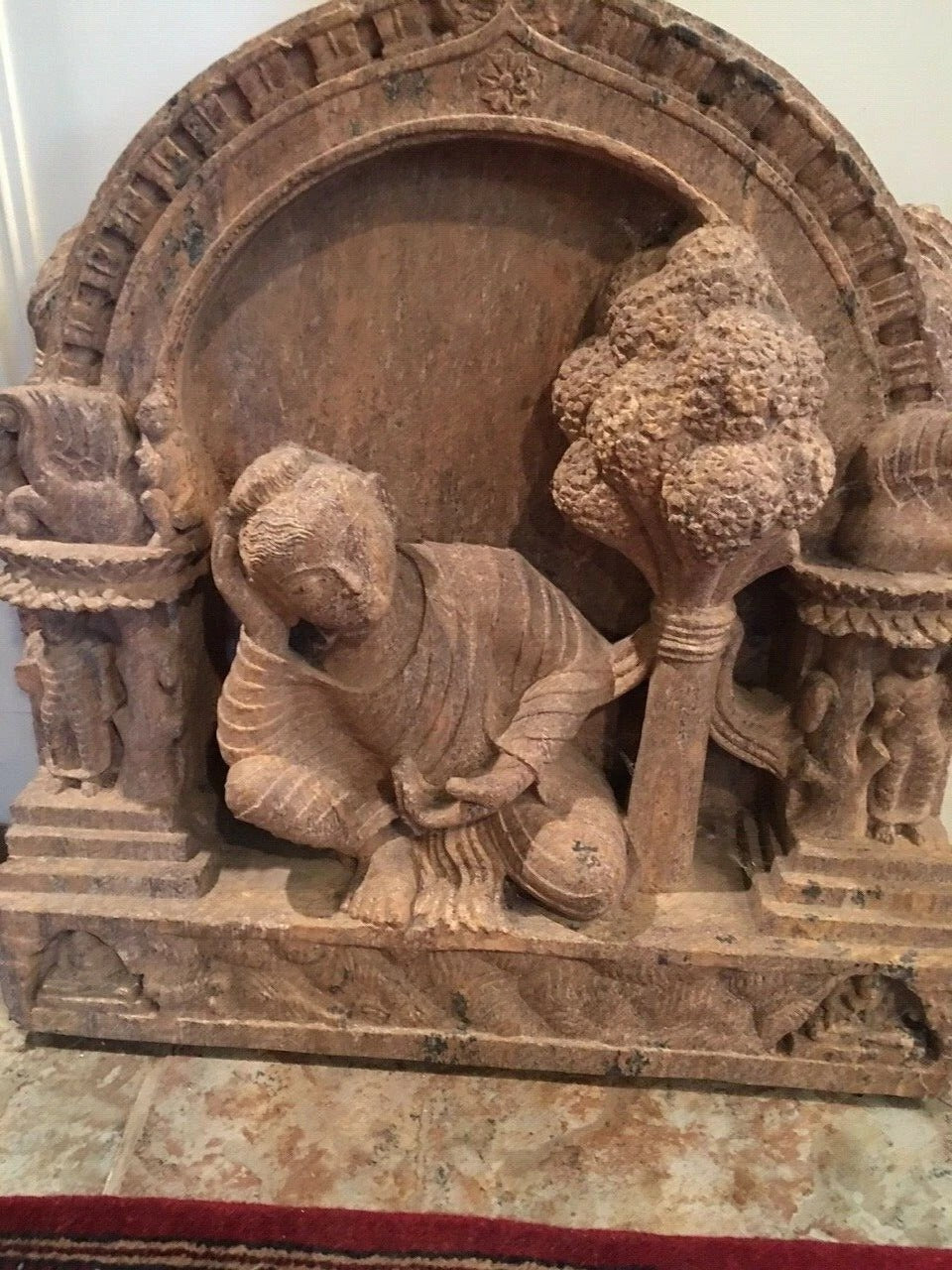 Front view of hand-carved sandstone Sleeping Buddha statue 24 inches