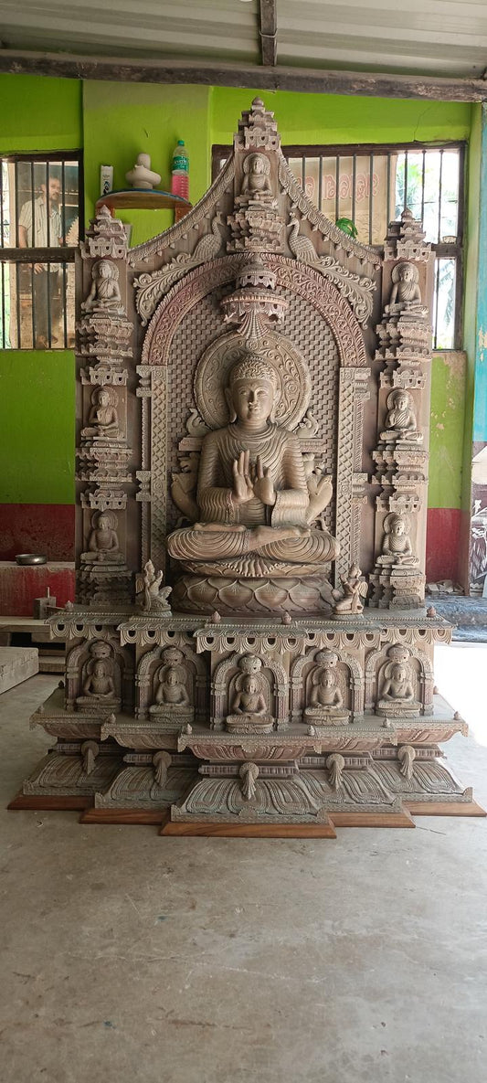Hand-carved sandstone Buddha statue inspired by Mahabodhi Temple with detailed Bodhisattva carvings