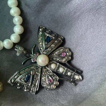 Handcrafted silver brooch with fluorite, ruby, and sapphire