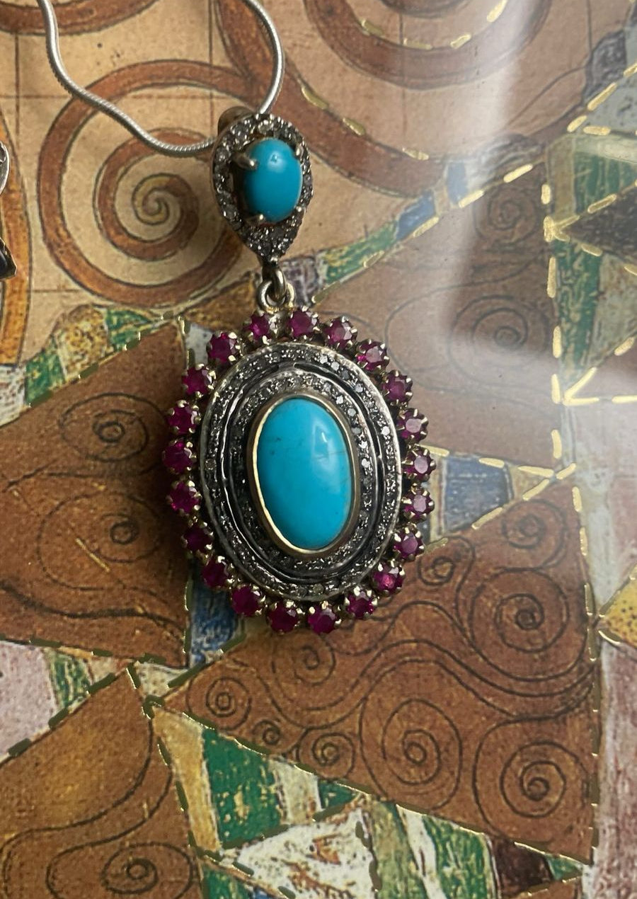 Handmade pendant with turquoise, ruby, and diamonds in vintage setting