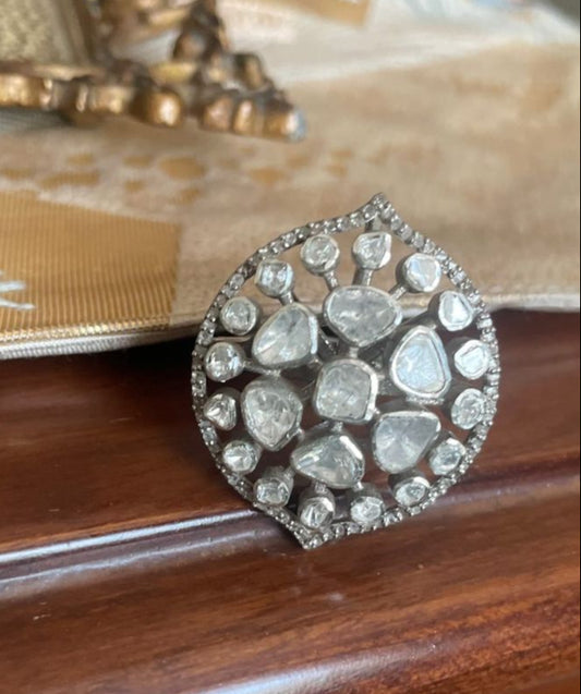 Luxurious handmade Polki diamond and brilliant-cut diamond statement ring with an intricate design, showcasing the unique beauty of uncut diamonds.