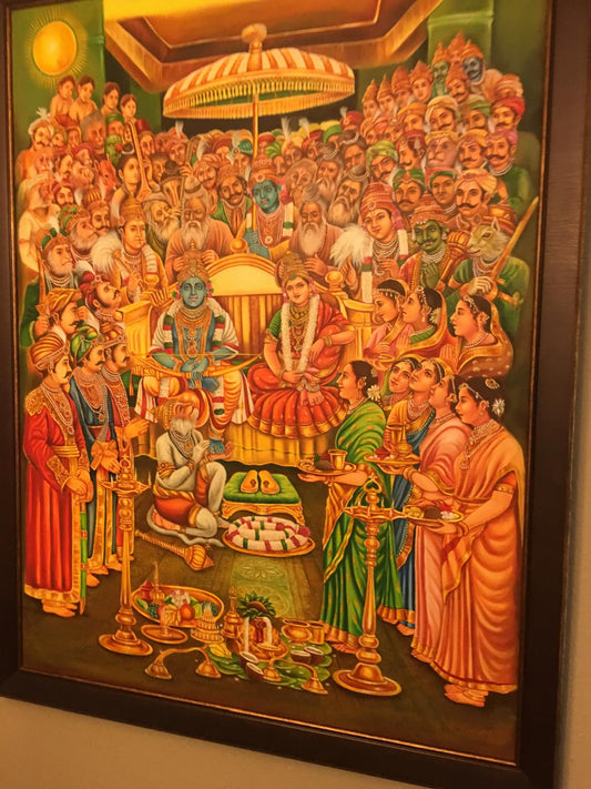 Framed, detailed traditional Indian painting showing a large gathering around a central royal couple, characteristic of a Ram Darbar, featuring rich colors and intricate designs.