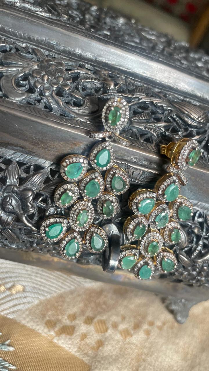 Vintage-style emerald dangle earrings with melee diamonds